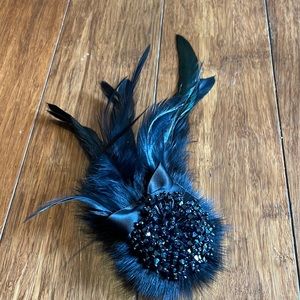 Black beaded and feather brooch